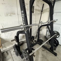 NAUTILUS OLYMPIC WEIGHT RACK WITH PULLY SYSTEM