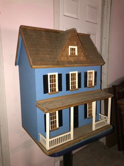 Wooden doll house with 56 pc furniture kit