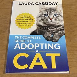 ADOPTING A CAT PAPERBACK BOOK/PRE-OWNED