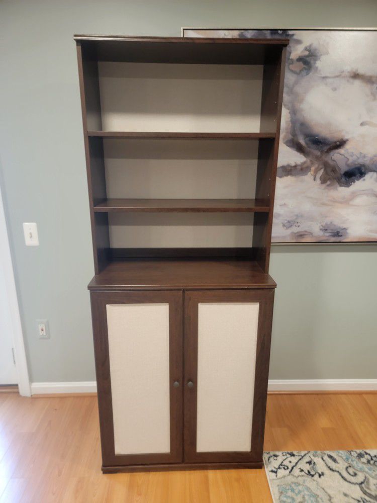 Fabric backed cabinet with doors 