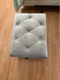 Grey storage ottoman.