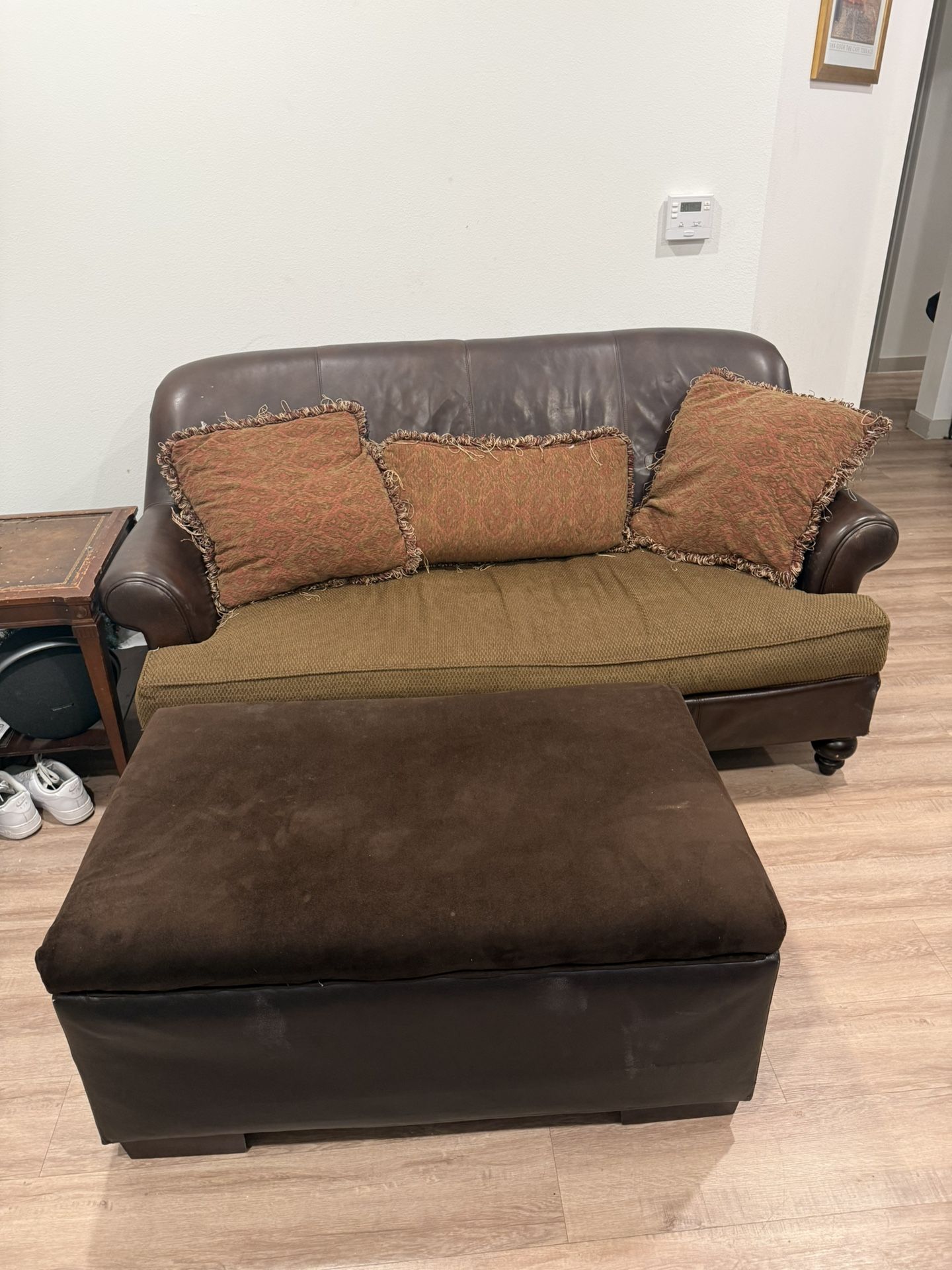 Brown love seat (ottoman Included)