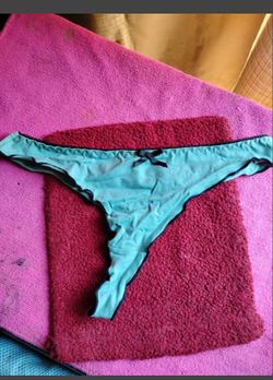 A Teal Colored Pair of Women's Thongs