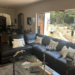 Gently used  Leather Sectional With Leather chair And Ottoman 
