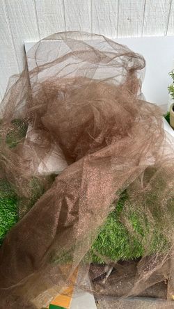 Tela de Tul con Purpurina (Glitter Tulle)El tejido seleccionado es una tela de tul translúcido decorada