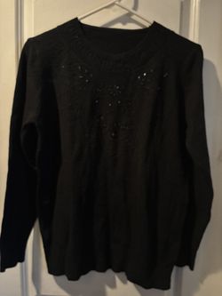 This is a Black Beautiful Sweater with Rhinestones size M