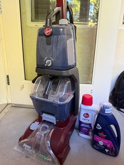 Hoover Power Scrub Deluxe Carpet Cleaner + Two cleaning products (one opened).