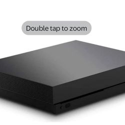 Xbox One X And Two Controllers