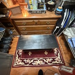 Black Bench with Lower Shelf  Solid black bench with a lower shelf for storage or display. Simple, sturdy design. Shows light cosmetic wear consistent