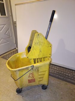 Commercial-grade utility mop bucket with an integrated side-press wringer.