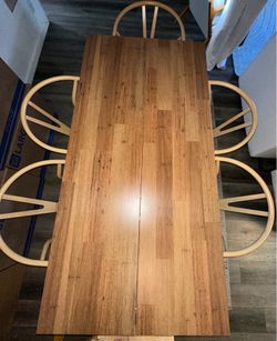 Wooden dining table with chairs