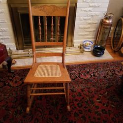 Vintage solid oak rocking chair.