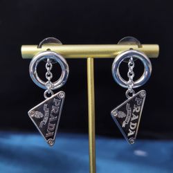 Pra.da Triangle Logo dangling earrings New