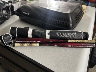 Two DeMarini voodoo bats with a Maruchi bat sleeve
