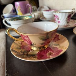 The Aynsley Bone China Pink Cabbage Roses Gold Footed Tea Cup & Saucer is a vintag