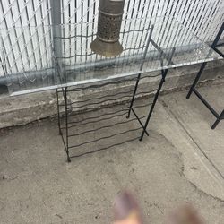 Wine bottle, glass top table