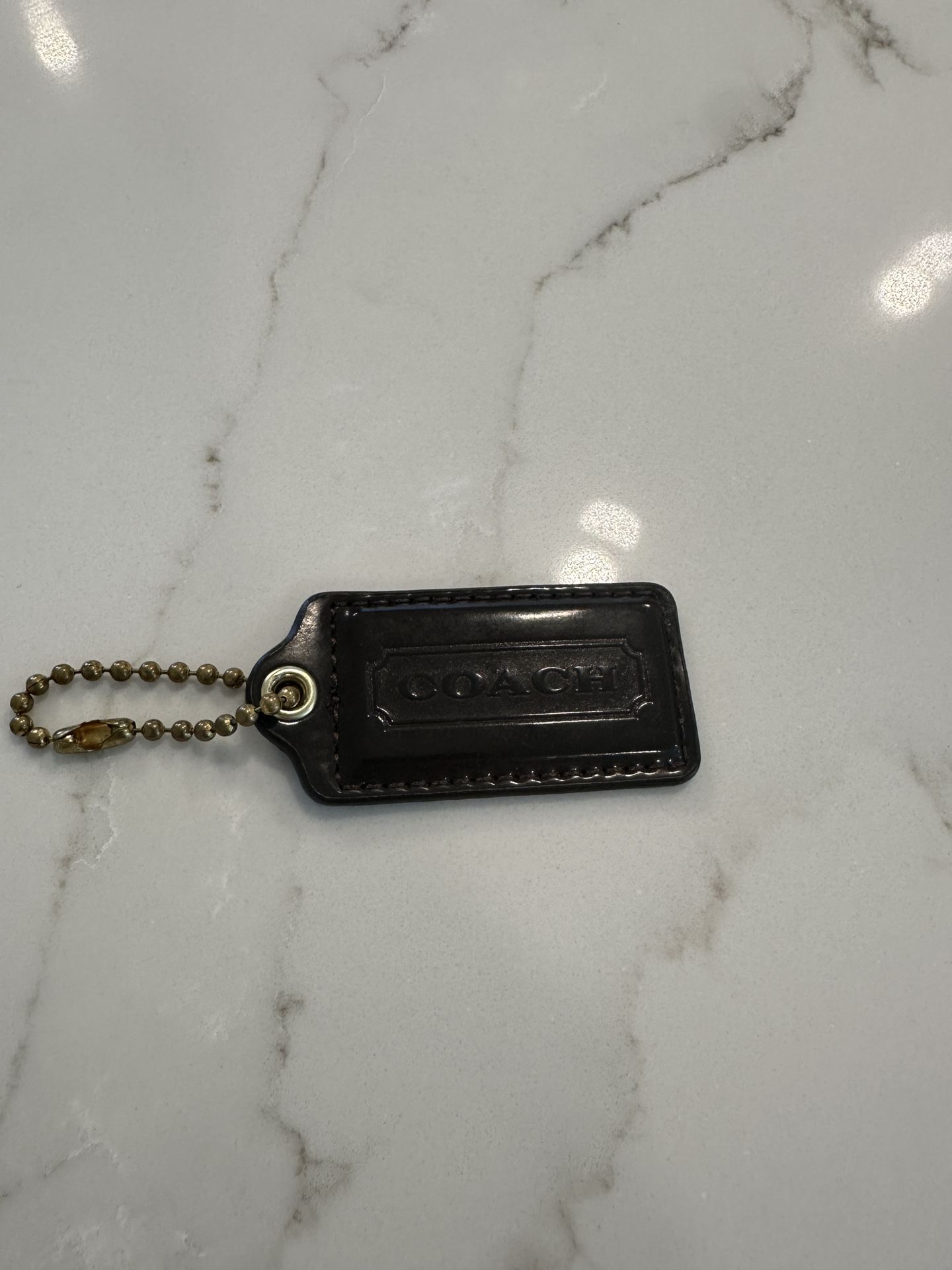 Brown Coach Hang Tag