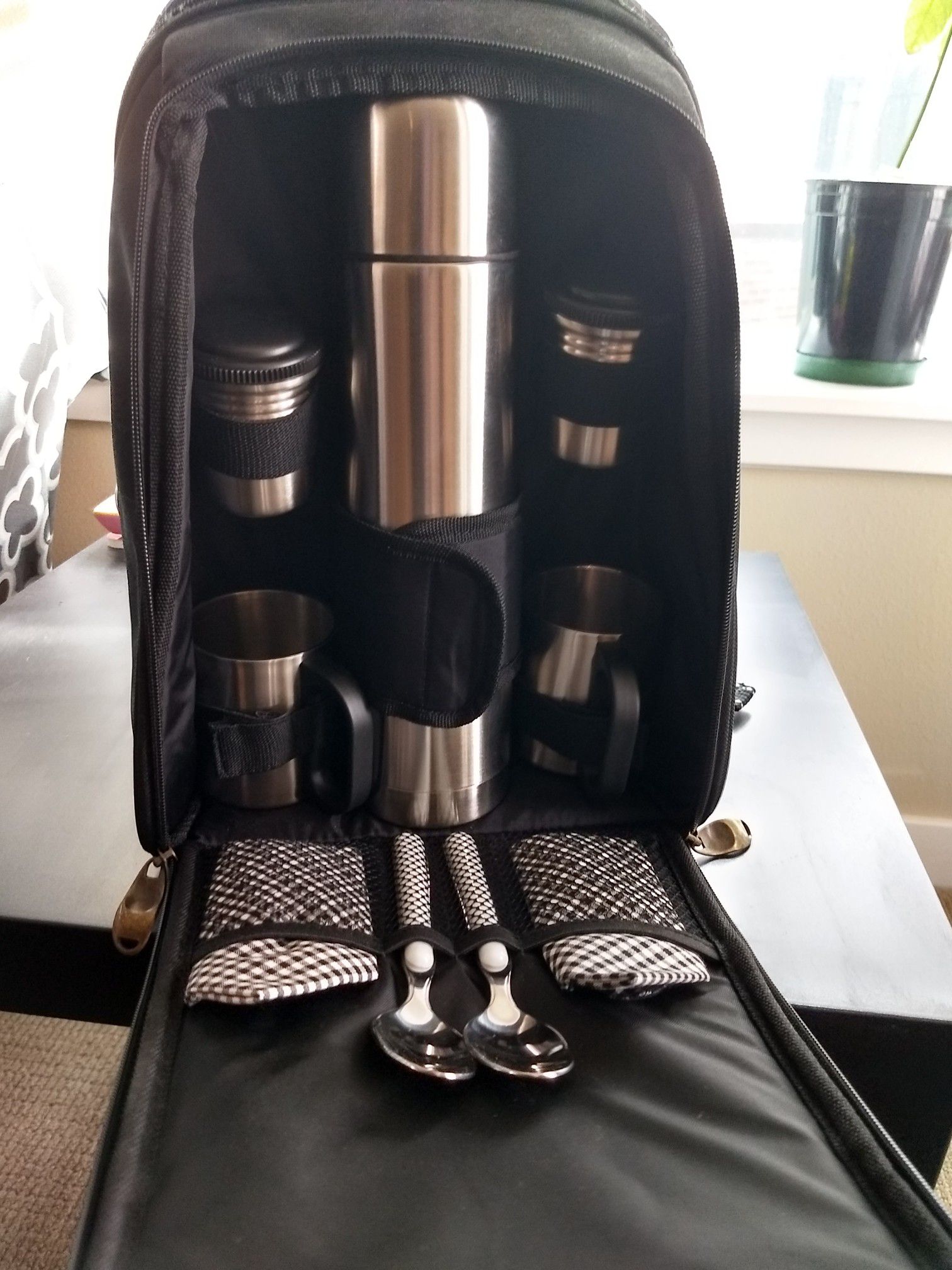 Picnic kit with thermos, cups, insulated backpack