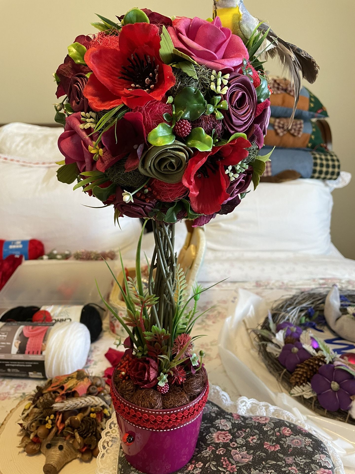 Christmas Flower Topiary with bird, flowers gatherings are falling into a lovely bouquet with a bird to greet visitors at the desktop of your office