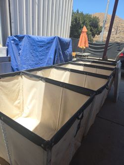nested heavy-duty commercial canvas laundry bins/carts (or canvas bin liners).