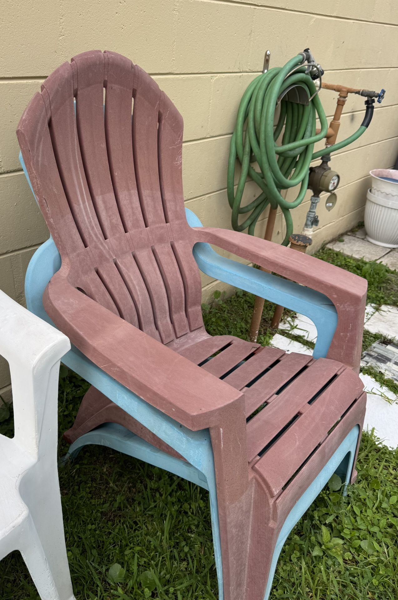 Set of two blue and coral resin patio Adirondack chairs