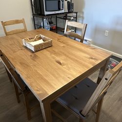 Dining table for 4, includes 4 chairs with seat cushions