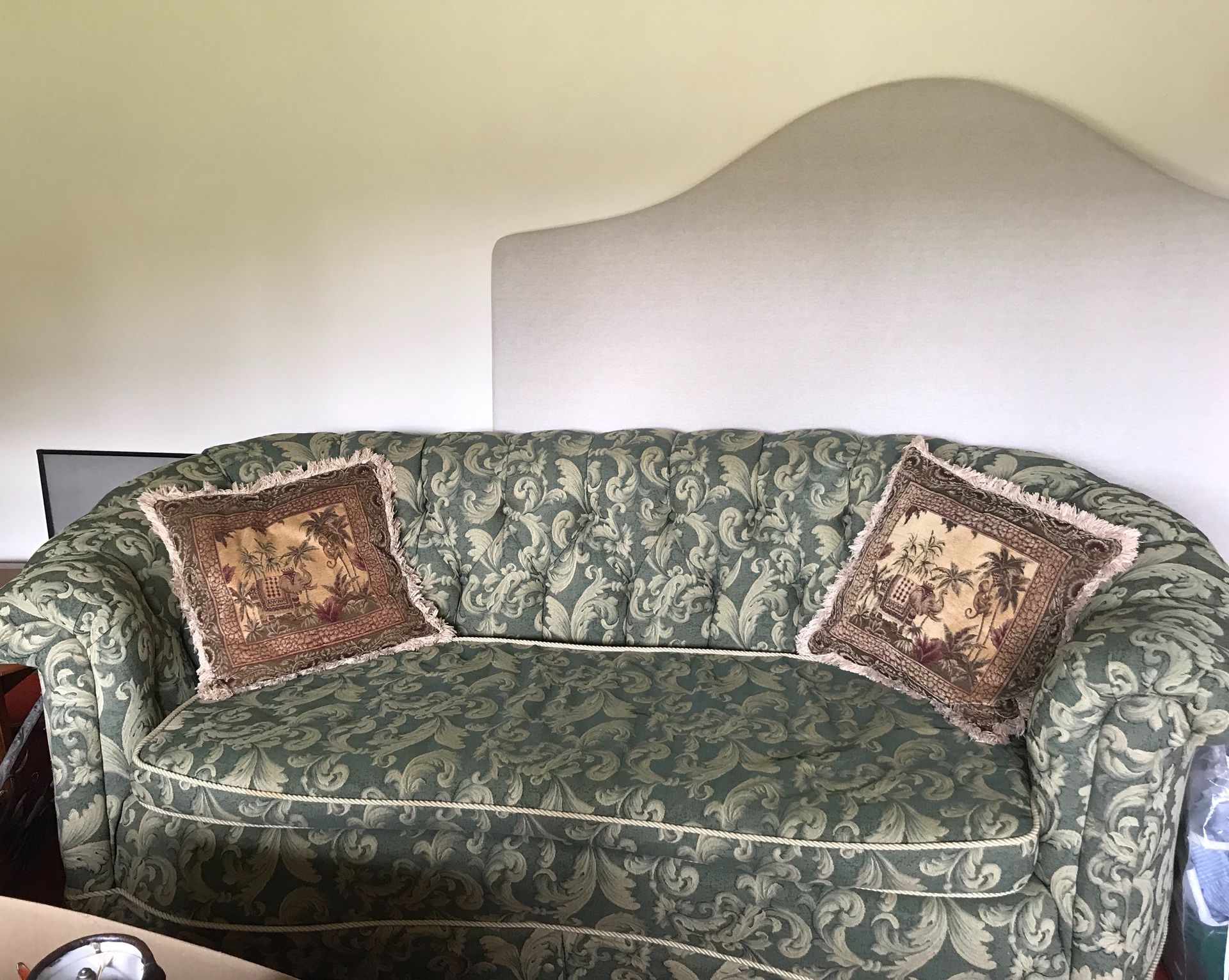 Antique sofa and two wing back chairs.