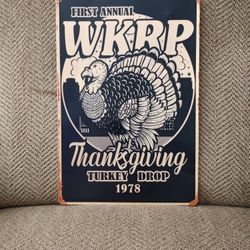 WKRP TURKEY DROP METAL SIGN (1978).  12" X 8".  NEW.  PICKUP ONLY.