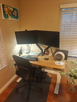 Autonomous SmartDesk 2 with a white frame and bamboo adjustable standing desk