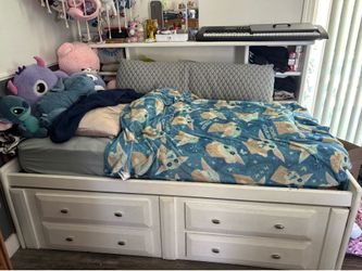 White daybed with bookcase headboard and dresser with mattress