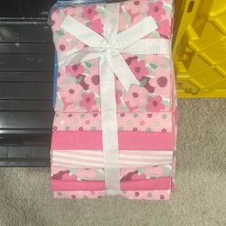 Baby girl receiving blankets