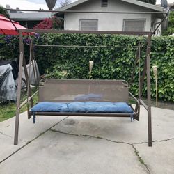 Porch Swing in good condition. pick up. as is. $115 all 4 corners have Velcro straps to hold the Cushion