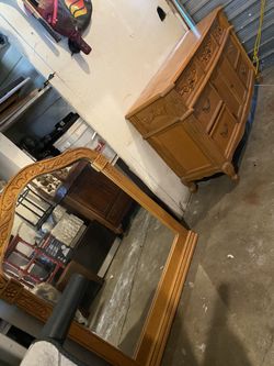 Dresser and mirror comes with screws and two wood pieces to attach mirror