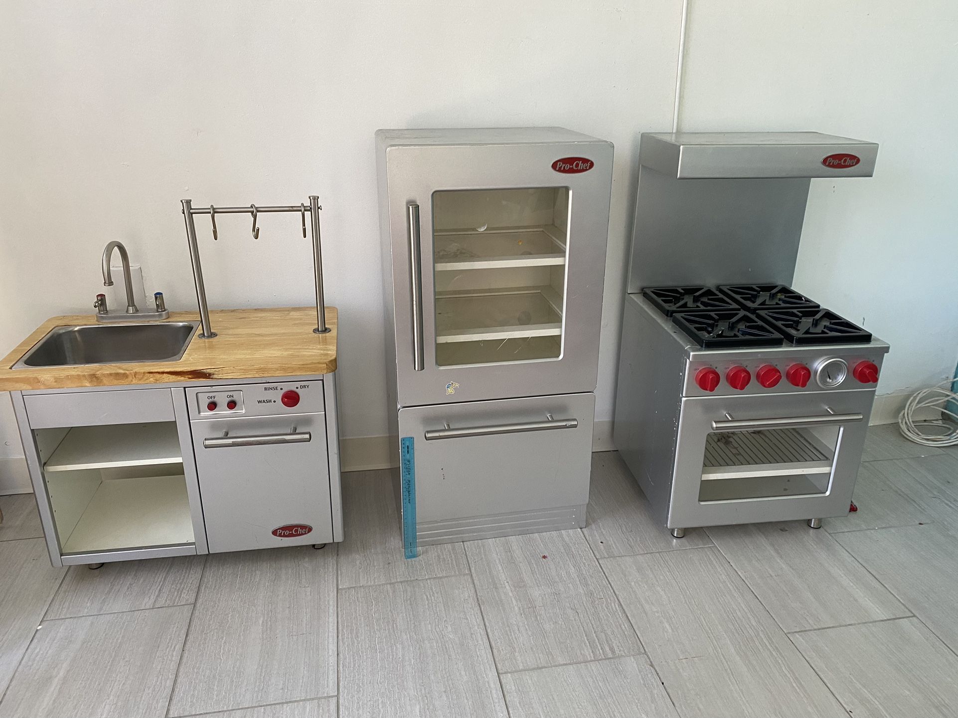 Pottery Barn kids Retro red kitchen set- includes refrigerator, sink, oven  and 4 stainless steel PBK small kitchen appliances. for Sale in Olathe, KS  - OfferUp