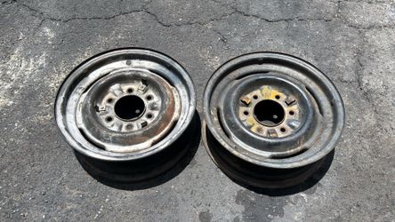 Two 15 Inch 6 Lug Steelies With clips from a Late 50s Chevy or Gmc Truck, One slightly bent
