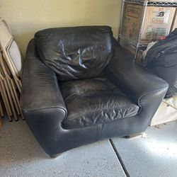 Black Leather Armchair & Ottoman