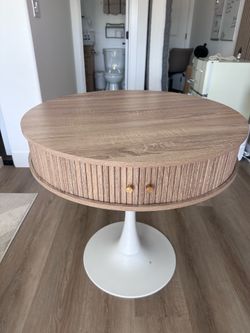 Modern circular dining table with storage