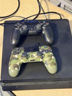 PS4 1TB W/2 Controllers. 