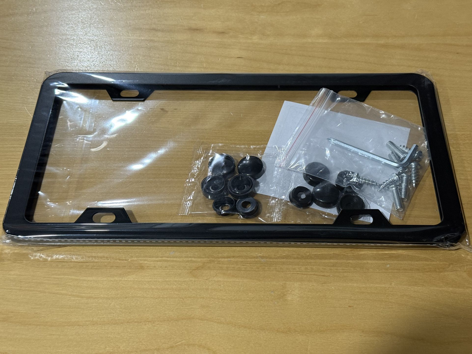 Brand New Sealed 2 pcs License Plates Covers. Stainless Steel with accessories.