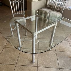 Dinning room glass table with 4 chairs