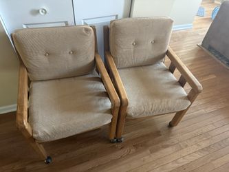 Two MCM Style Rolling Chairs