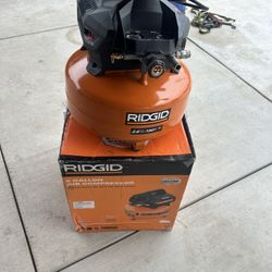 RIDGID 6 Gal. 150 PSI Portable Electric Oil-Free Jobsite Pancake Air Compressor with Dual Pressure Gauges and 2-Quick Couplers