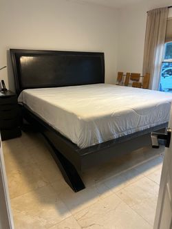 King size bed , leather headboard and wood bed