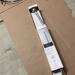 Curved tension shower rod