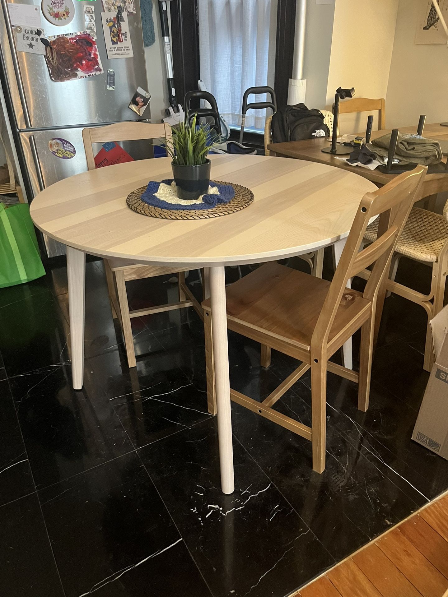 Round light wood dining table