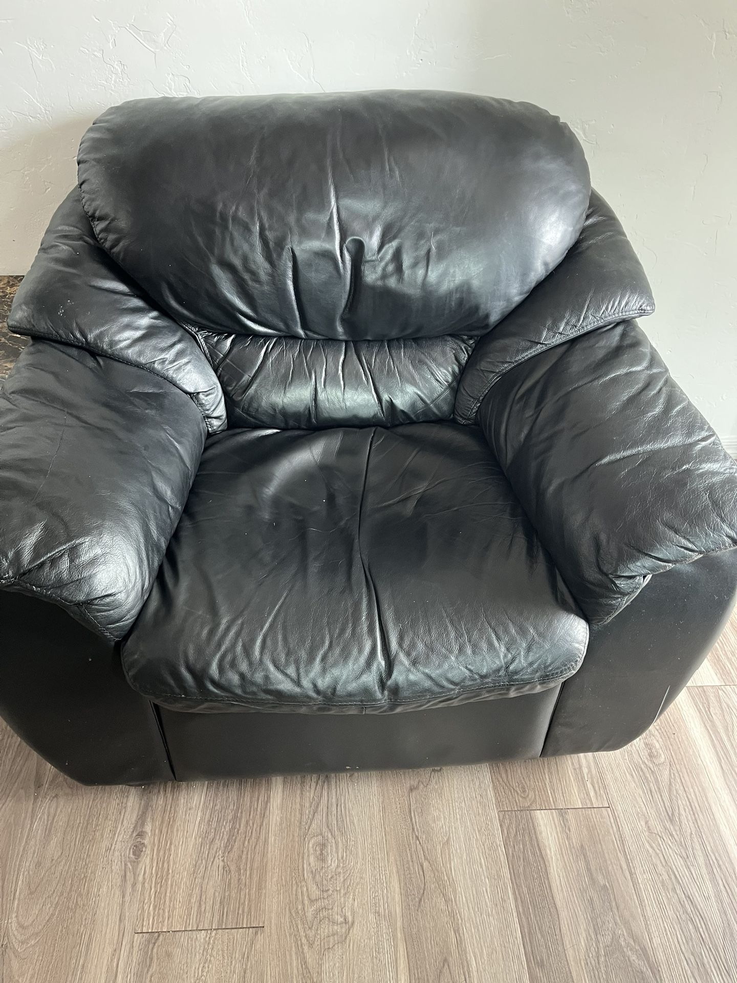 Three piece, leather sofa, armchair, and ottoman