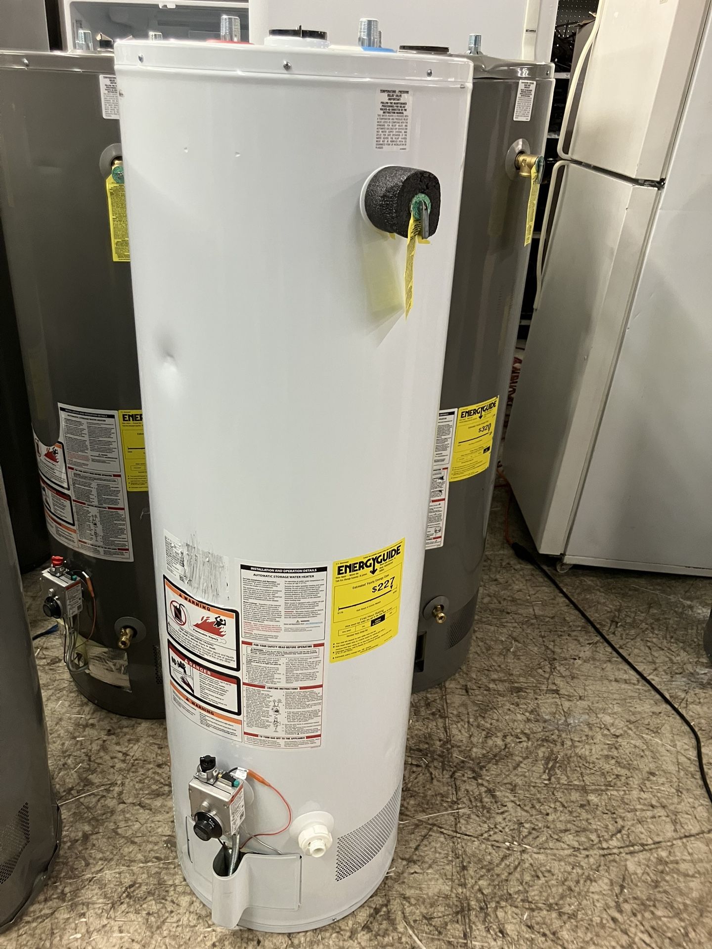 ENERGY GUIDE Water Heater - Natural Gas Rheem Sales Company, Inc. Tank Size (Storage Capacity): 38 gallons