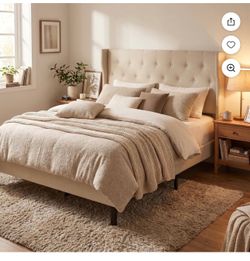 Beige upholstered queen bed frame