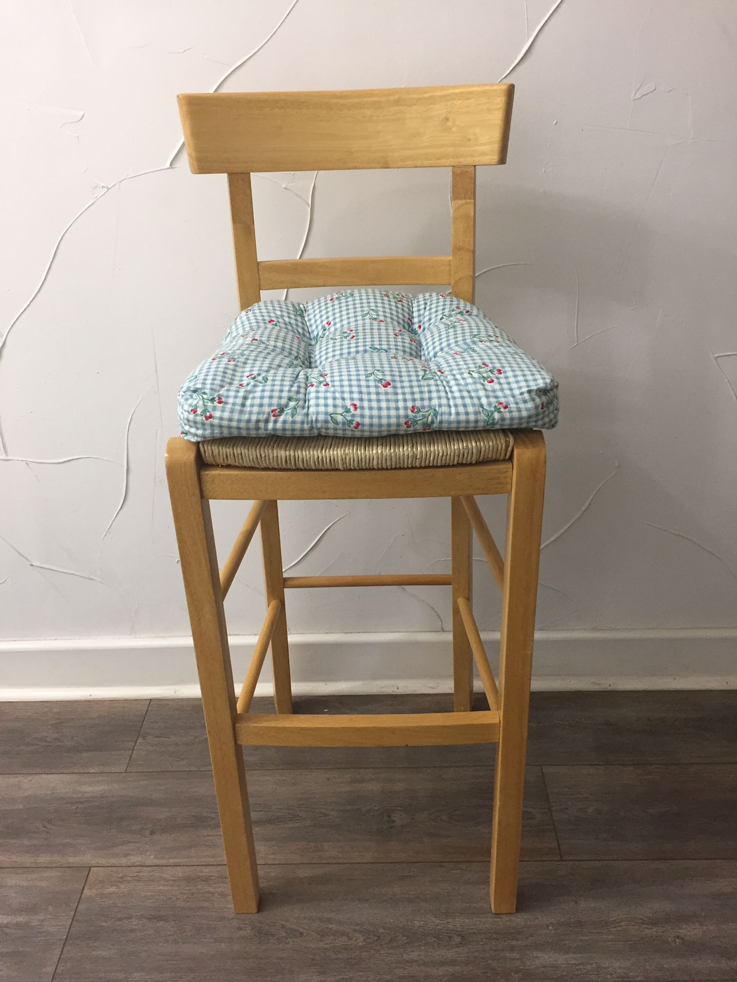 wooden barstool with woven seat and removable cushion
