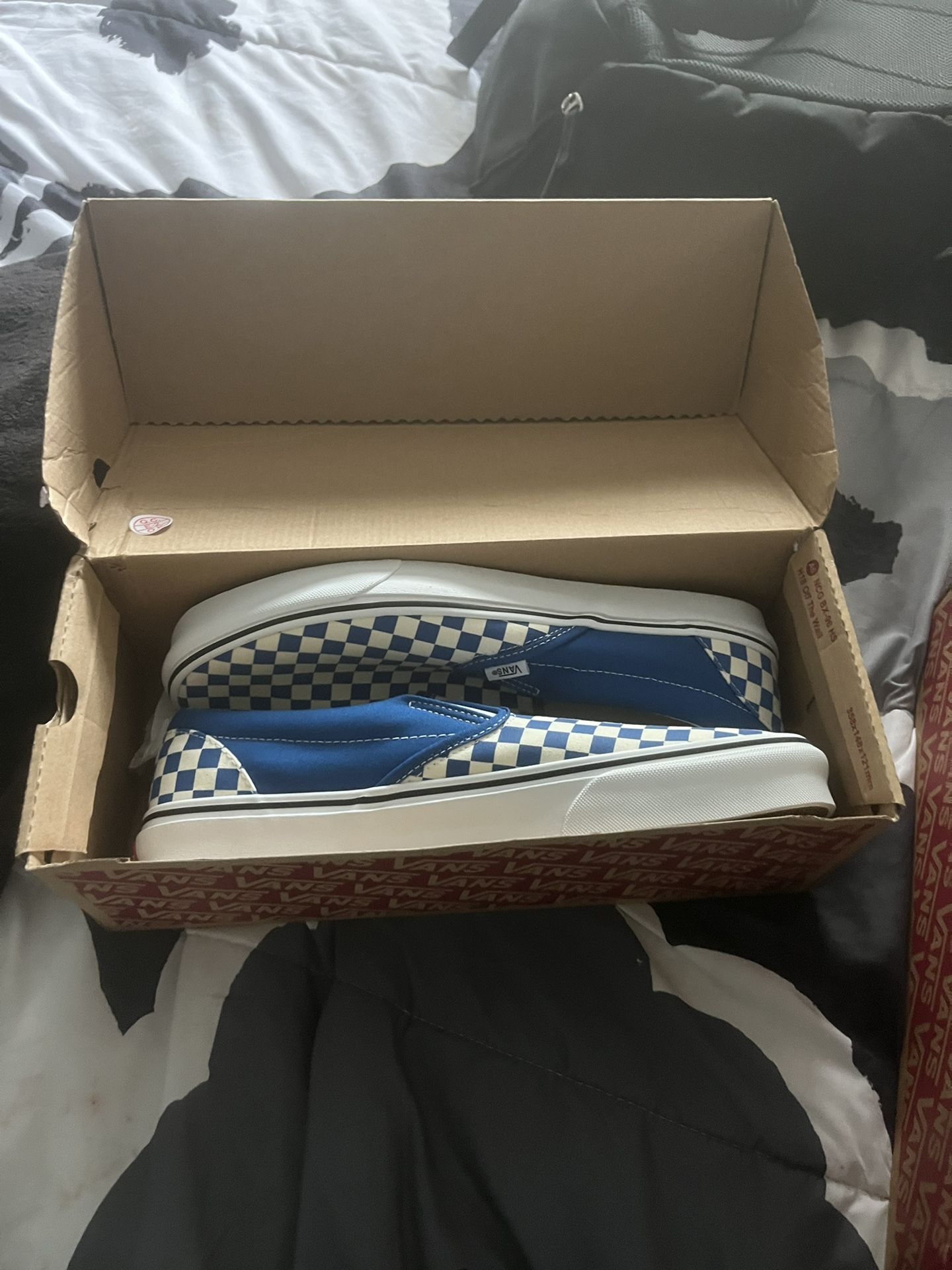 Blue and gray slip on vans